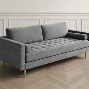 Alabaster grey 3-seater sofa with tufted seat and gold legs, styled in a modern living room, available at SKM Furniture Perth
